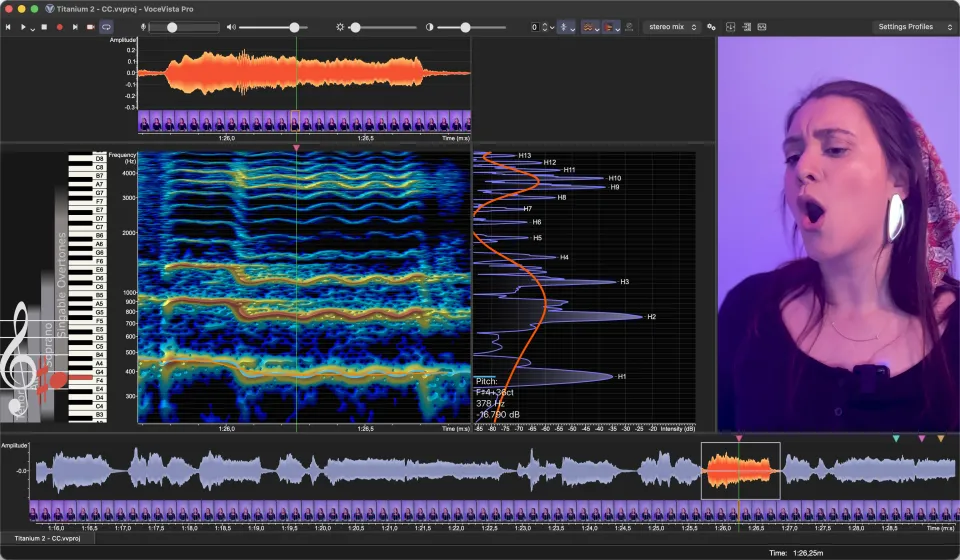 A singer's video beside the spectrogram and harmonic spectrum, with a filmstrip of video frames under the waveform